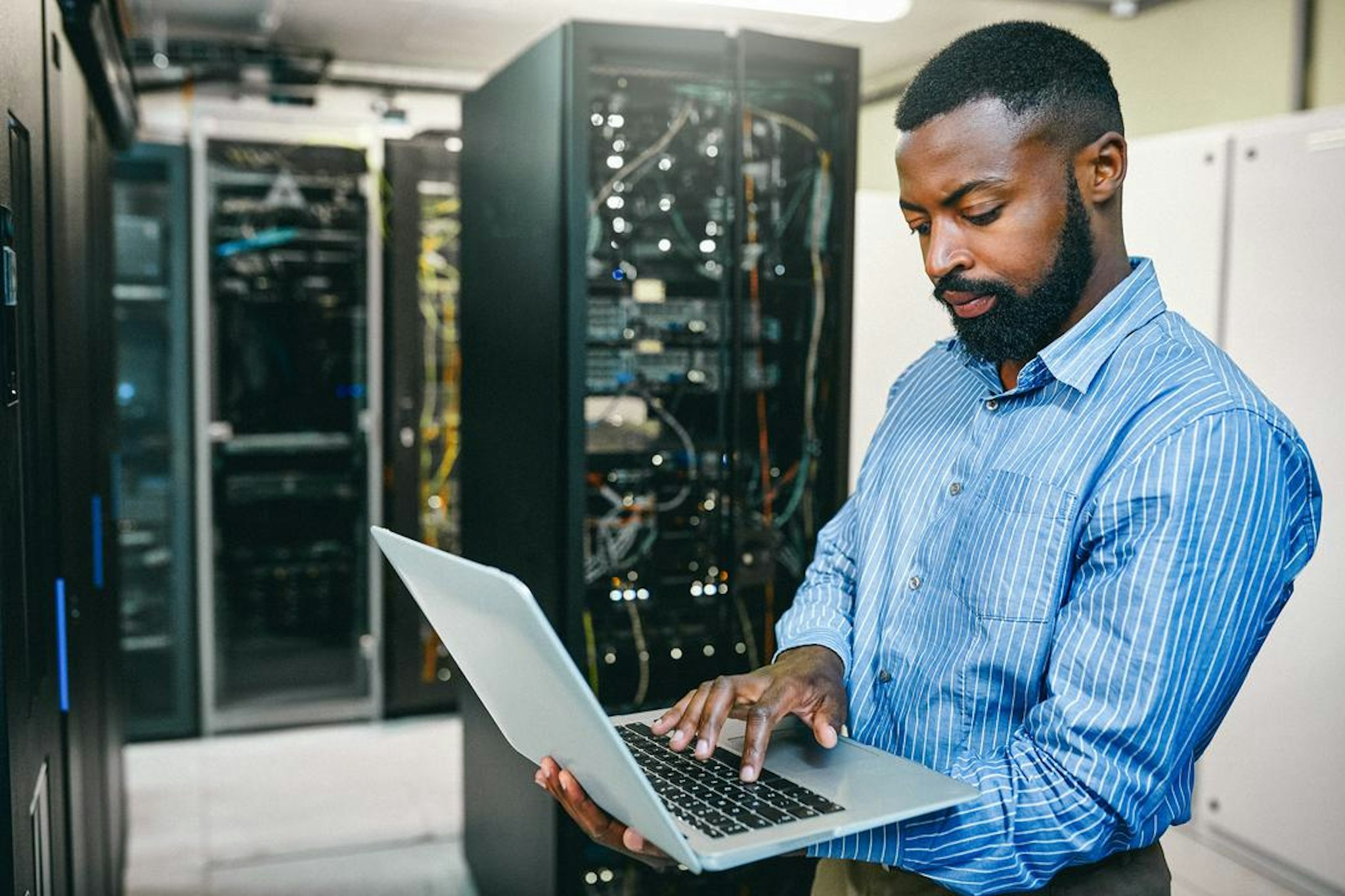 man working with artificial intelligence on computer