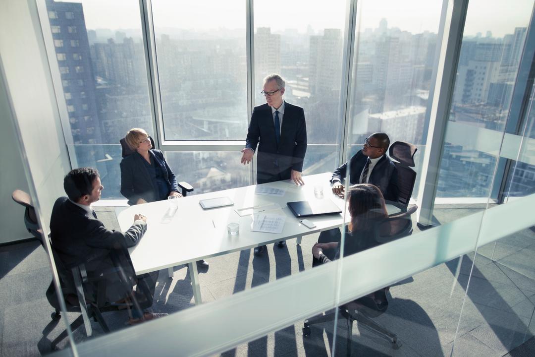 Colleagues discussing the top corporate governance trends for 2025 and beyond